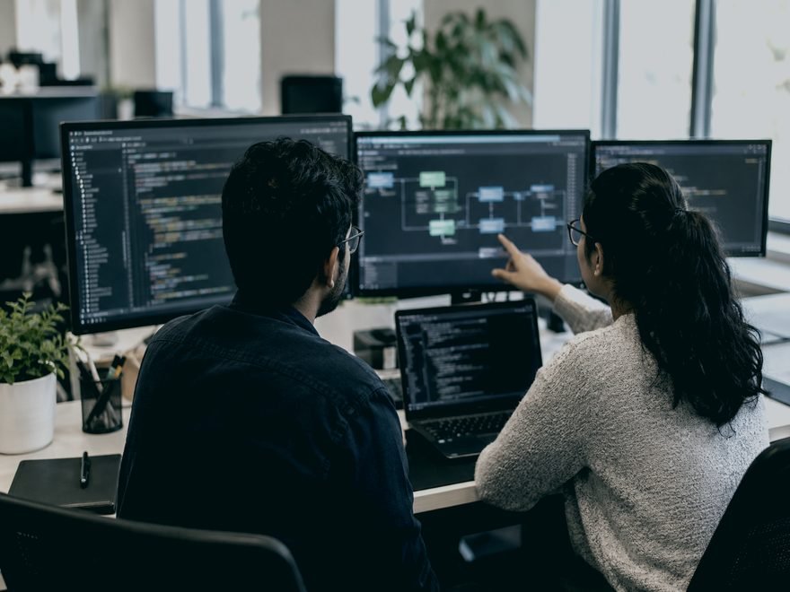 Engineers reviewing a delivery pipeline on screen